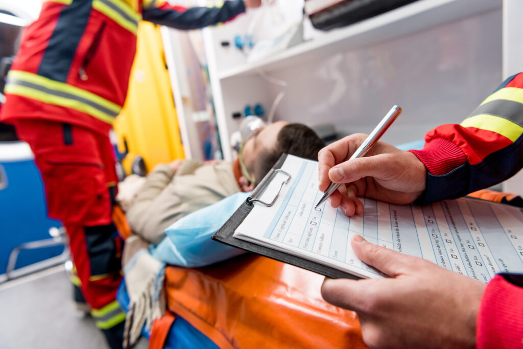 Paramedic writing patient documentation 
